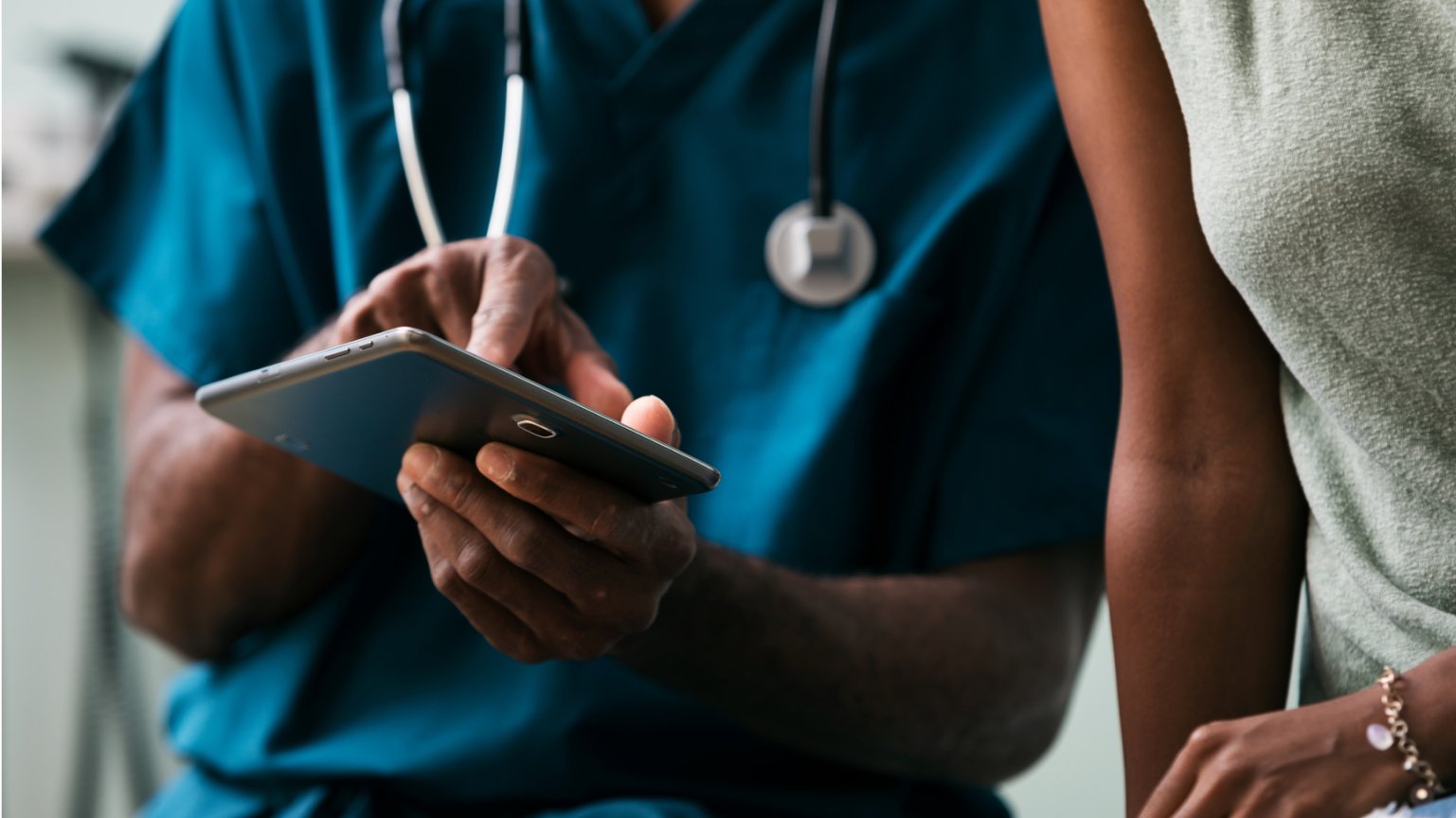 An ipad being used by a doctor